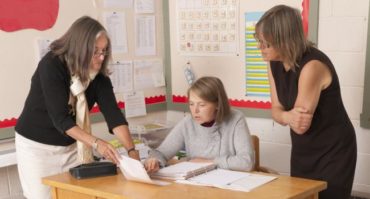 teachers working together in classroom