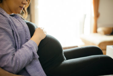 Pregnant woman resting at home