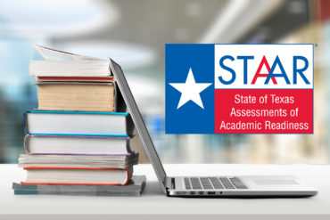 laptop computer with books and STAAR test logo