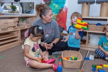 Teacher working with kids at Becky Gates Children's Center