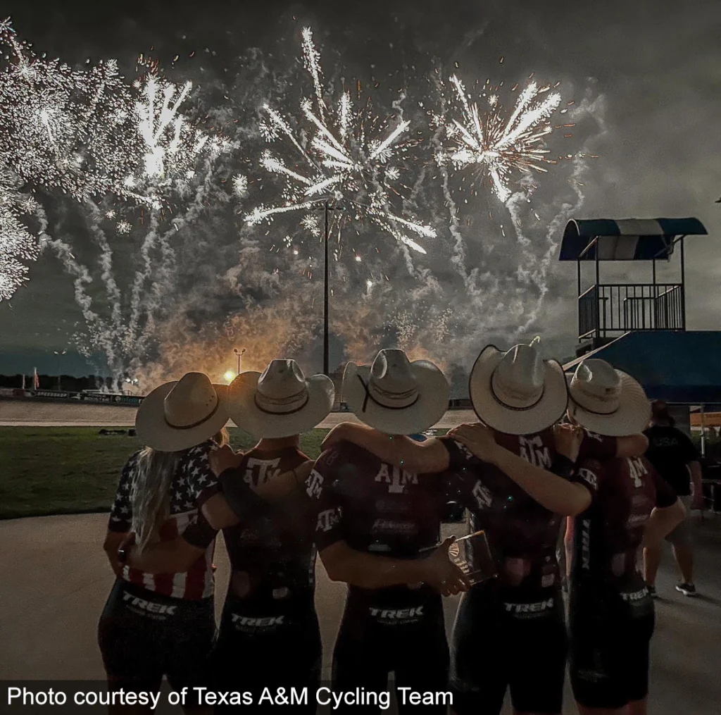 Texas A&M Cycling team at night enjoying fireworks after winning the National Championship.